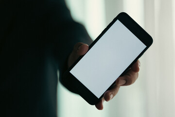 Close up hand holding smartphone