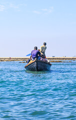 People at the touristic boat in Chera Dwip, Bangladesh, Water public transport in the city. Tourist boat in the sea on summer holiday.