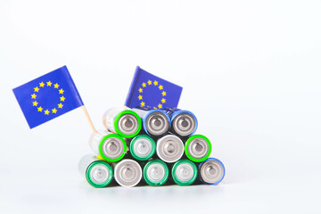 Battery. A lot of batteries on the background of the flag of the country.