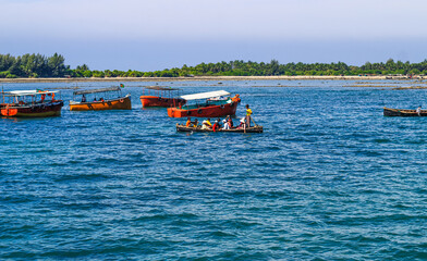 Tourist jetty of St. Martin's Island, Bangladesh. Photo of a seaport on an island with many ships docked. Good to use for outdoor and something about facilities or transporter content.