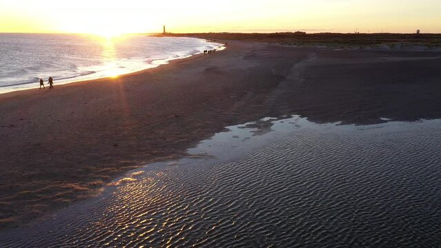 Drone Over People Walking Along Grenen Sandbar