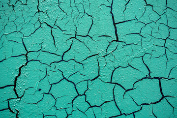 Obraz premium Cracked and damaged painted surface of a building or wall. Texture, aged paint background