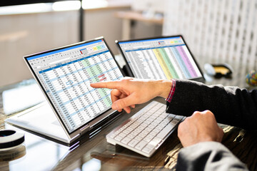 Analyst Employee Working On Spreadsheet