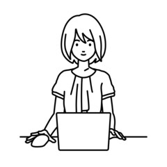 デスクで座ってPCを使っているオフィスカジュアルの女性