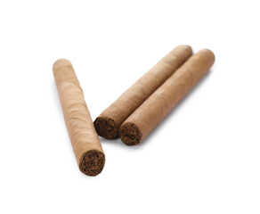 Cigars wrapped in tobacco leaves on white background