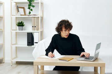 teenager laptop sitting on white sofa online training living room