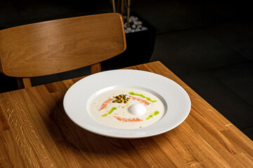 Cauliflower soup puree with shrimp and egg