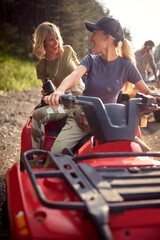  young friends female driving a off road buggy car