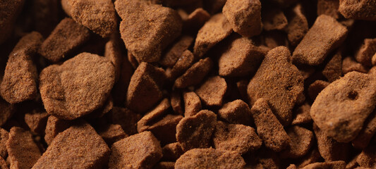 Instant coffee granules as background.