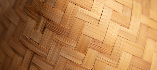 Wicker wooden hat as an abstract background. Close-up