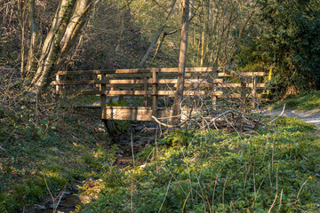 A wooden bridge crossing the Sandersbach in Ratingen, North Rhine-Westphalia, Germany