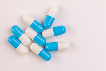 Colorful pill capsule on white background.