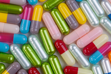Colorful pill capsule on white background.