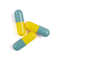 Colorful pill capsule on white background.