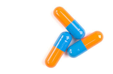 Colorful pill capsule on white background.