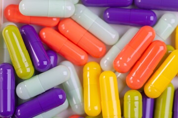 Colorful pill capsule on white background.