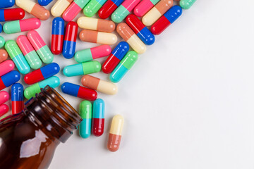 Colorful pill capsule on white background.