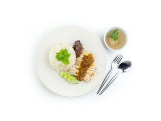 Top view of Hainanese chicken rice with hot soup and spicy sauce isolated on white background