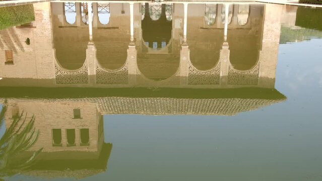 Garden of the Partal,  Alhambra Granada. Reflection in the water. Moorish Architecture. Unesco Unesco World Heritage Spain. Travel in time and discover history. Amazing destinations for holidays. 
