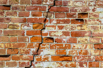 Old brick wall with big crack