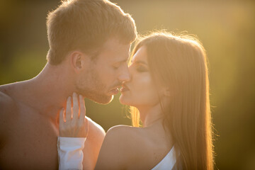 Sensual kiss. Man kissed tender woman. Portrait of lovely couple in love. Young sensual girlfriend...