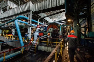 Rudny, Kostanay region, Kazakhstan-May 28 2012: Sokolovo-Sarbay power plant workshop interior. Steam boiler's metal pipes and electric machine.