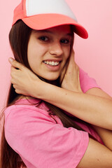 Fototapeta premium smiling woman pink t-shirts with cap on her head fashion summer style