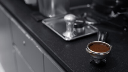 coffee tamper on coffee machine