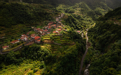 Village in green mountainous valley