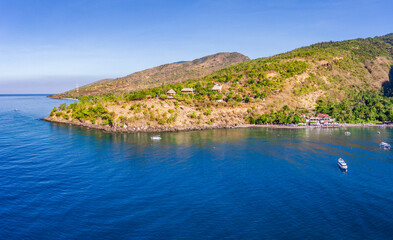 Naklejka premium Aerial panoramic image of a cliff on Amed beach on Bali island, Indonesia