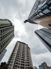 Group of Common modern business skyscrapers, high-rise buildings, architecture raising to the sky in Jakarta, Indonesia. Concepts of financial, economics, future etc.