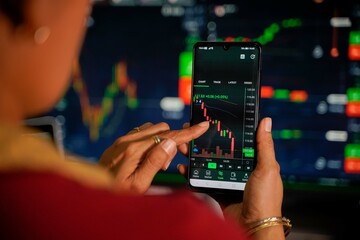 Traders looking at the stock chart with blurry chart background The concept of virtual currency