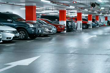Parking garage underground interior background or texture. Concrete grunge wall and column with...