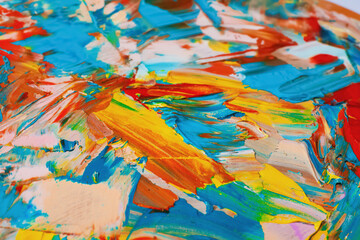 Obraz na płótnie Canvas Closeup view of artist's palette with mixed bright paints as background