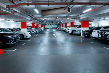 Parking garage underground interior background or texture. Concrete grunge wall and column with...