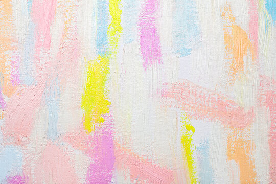 Strokes of different pastel acrylic paints on white canvas, closeup © New Africa