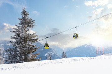 Fototapeta na wymiar Cable car in a skiing resort in Europe during winter holiday vacation.