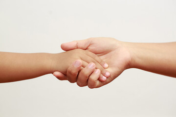 mother holding daughter's hand to show love and warmth to children