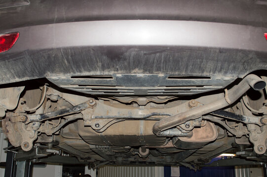 View of the rear multi-link suspension of the car during repair in an auto repair shop