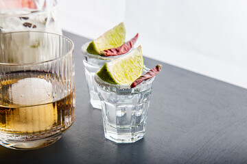 Closeup detail view of tequila shots from studio with copy space.