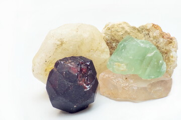 Five different stone minerals on a white background