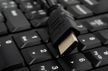 Close-up of a black HDMI cable. Cable for communication and high-speed Internet