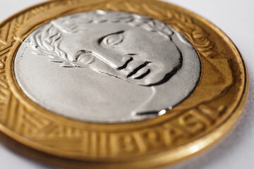 Brazilian 1 real coin close-up. Reverse of the coin with the Figure of the Republic, the national symbol of Brazil. Illustration about money, finance, currency and economy. Macro