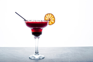 Closeup detail view of strawberry active carbon alcohol cocktail from studio with copy space.