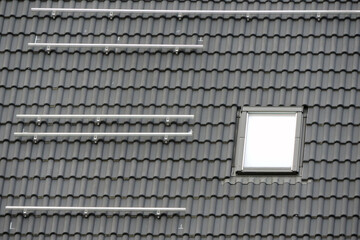 Installation of a mounting structure for solar panels on a roof of a house