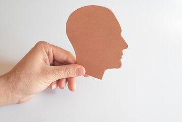 Human silhouette from eva paper in woman's hand.
autism, epilepsy, alzheimer awareness.
world...