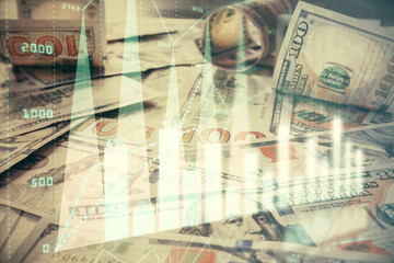 Multi exposure of forex chart drawing over us dollars bill background. Concept of financial success markets.