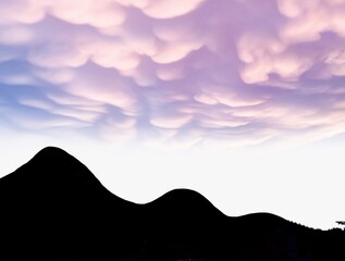 Wavy clouds over mountains illustration 
