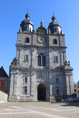 Fototapeta premium View of the western baroque style facade of the Basilica of St. Hubert in the town of St. Hubert in the province of Luxembourg in the Belgian Ardennes.