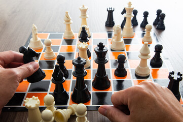 Hand moving a chess piece